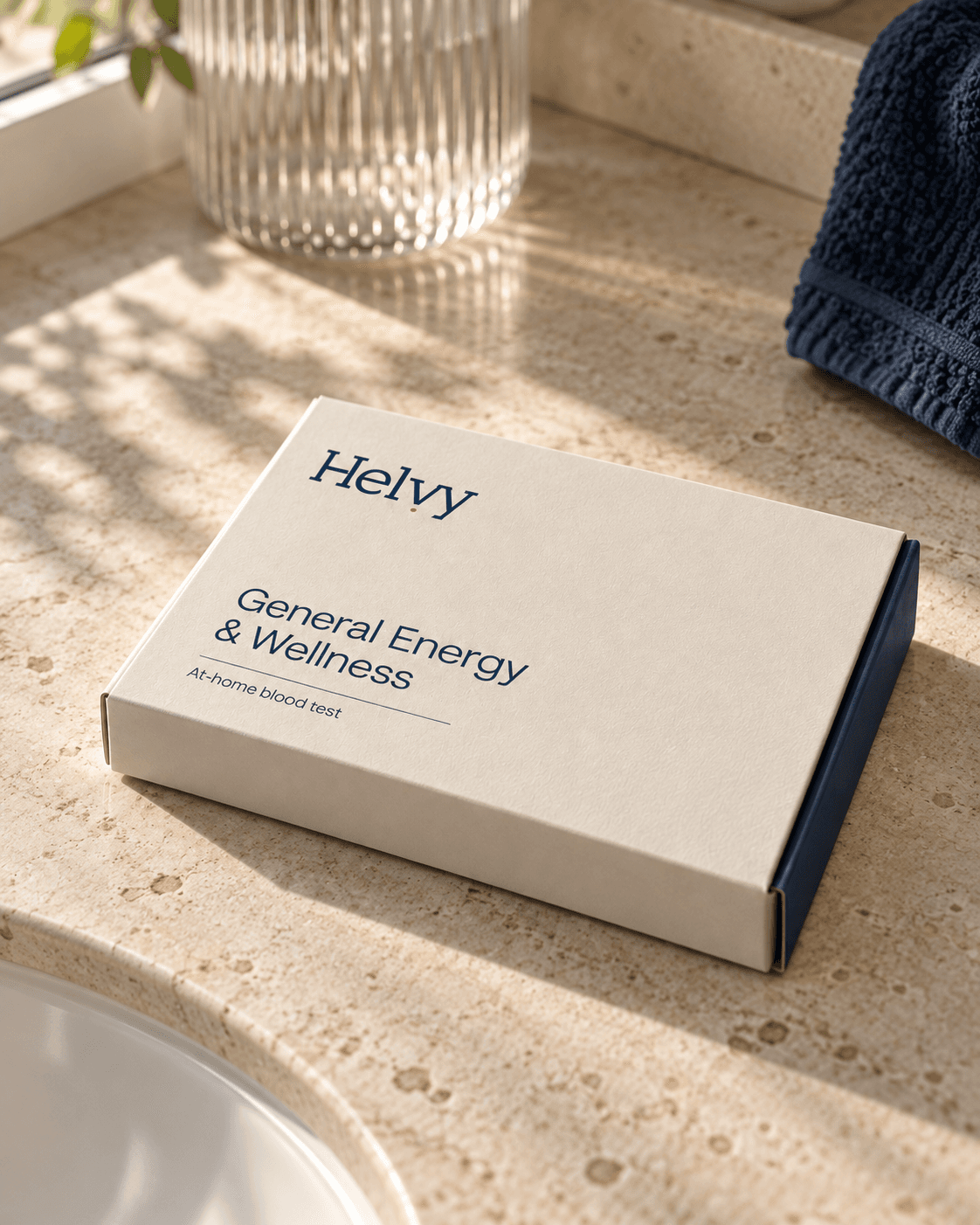 Illustrative Helvy General Energy & Wellness blood test kit on a sunlit stone surface